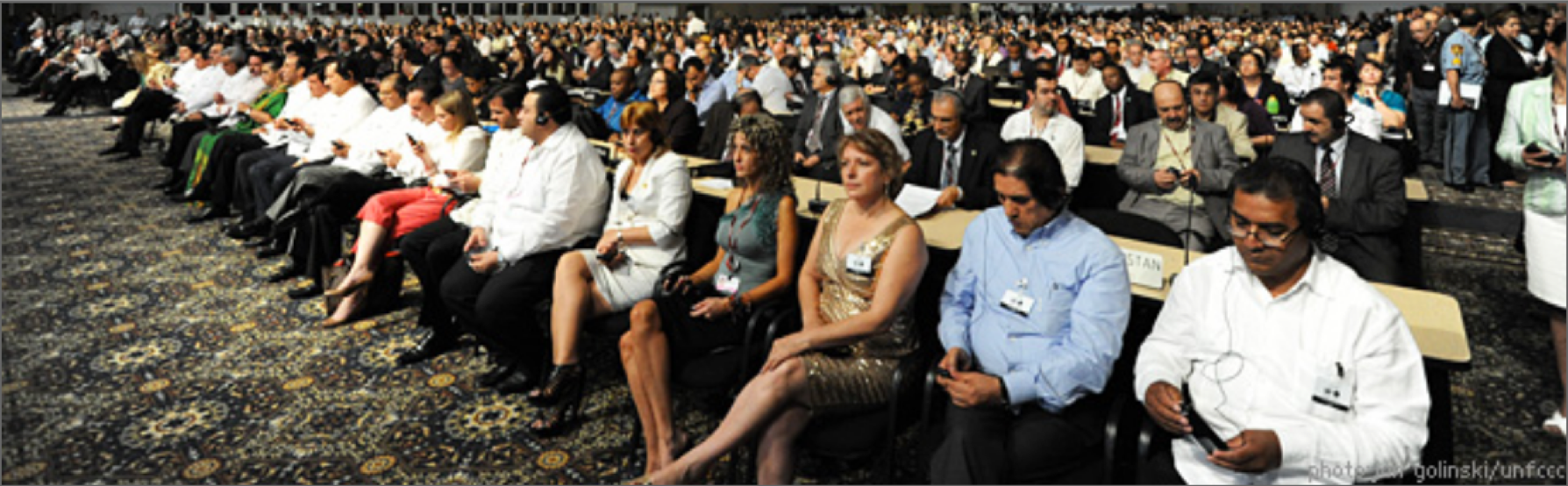 Image of distracted audience at UNFCCC meeting.